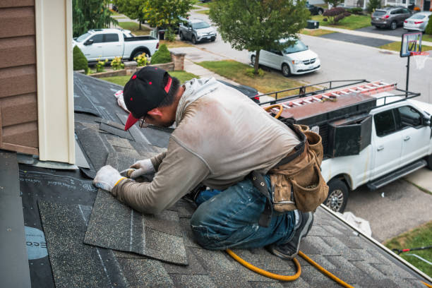 Professional Roofing technician working in Deer Island, OR